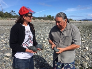 Elder Earl Claxton Jr. and Madelin Emery collecting stones for pit cook. Photo by P. Petrie.